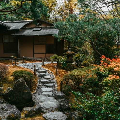 An East Texas home with a freshly-laid stone pathway leading to the front door.